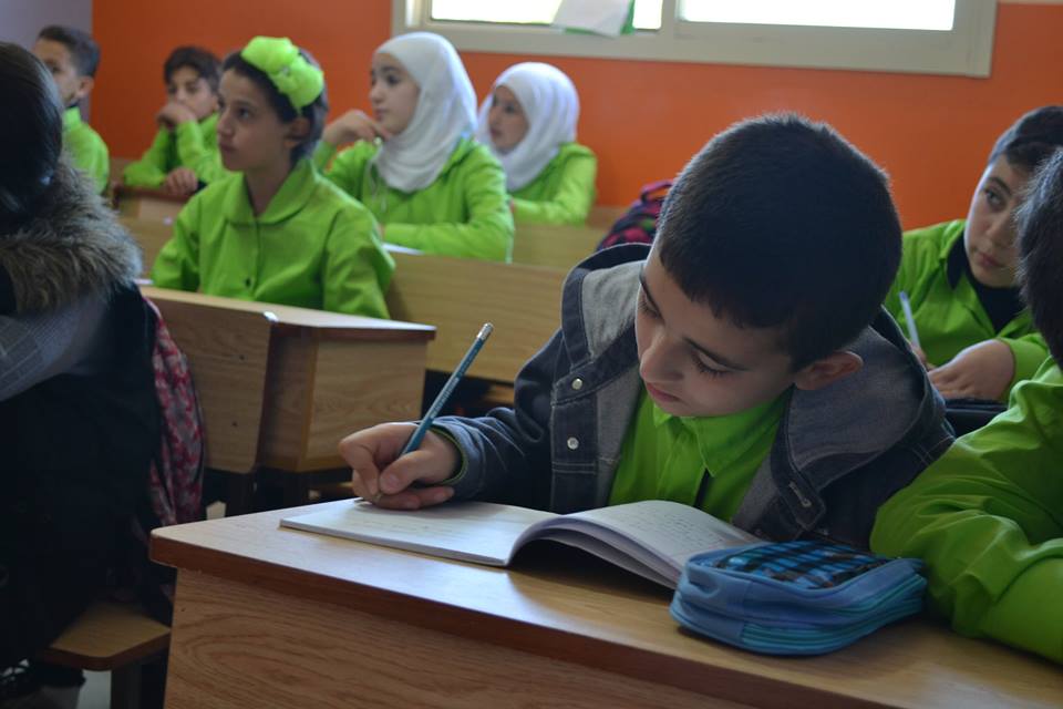 Syrian students studying inside a classroom
